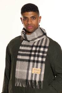 A folded check cashmere scarf in a high-quality gift box.