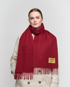 A luxury boutique display featuring the Lunar New Year collection of cashmere scarves.